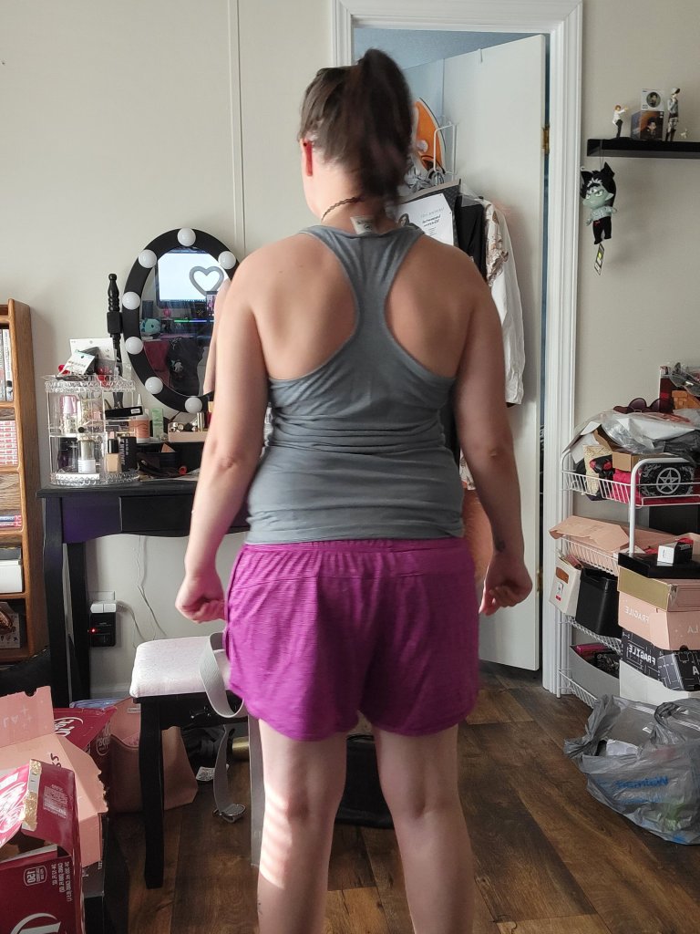 Back view of Niki in exercise gear